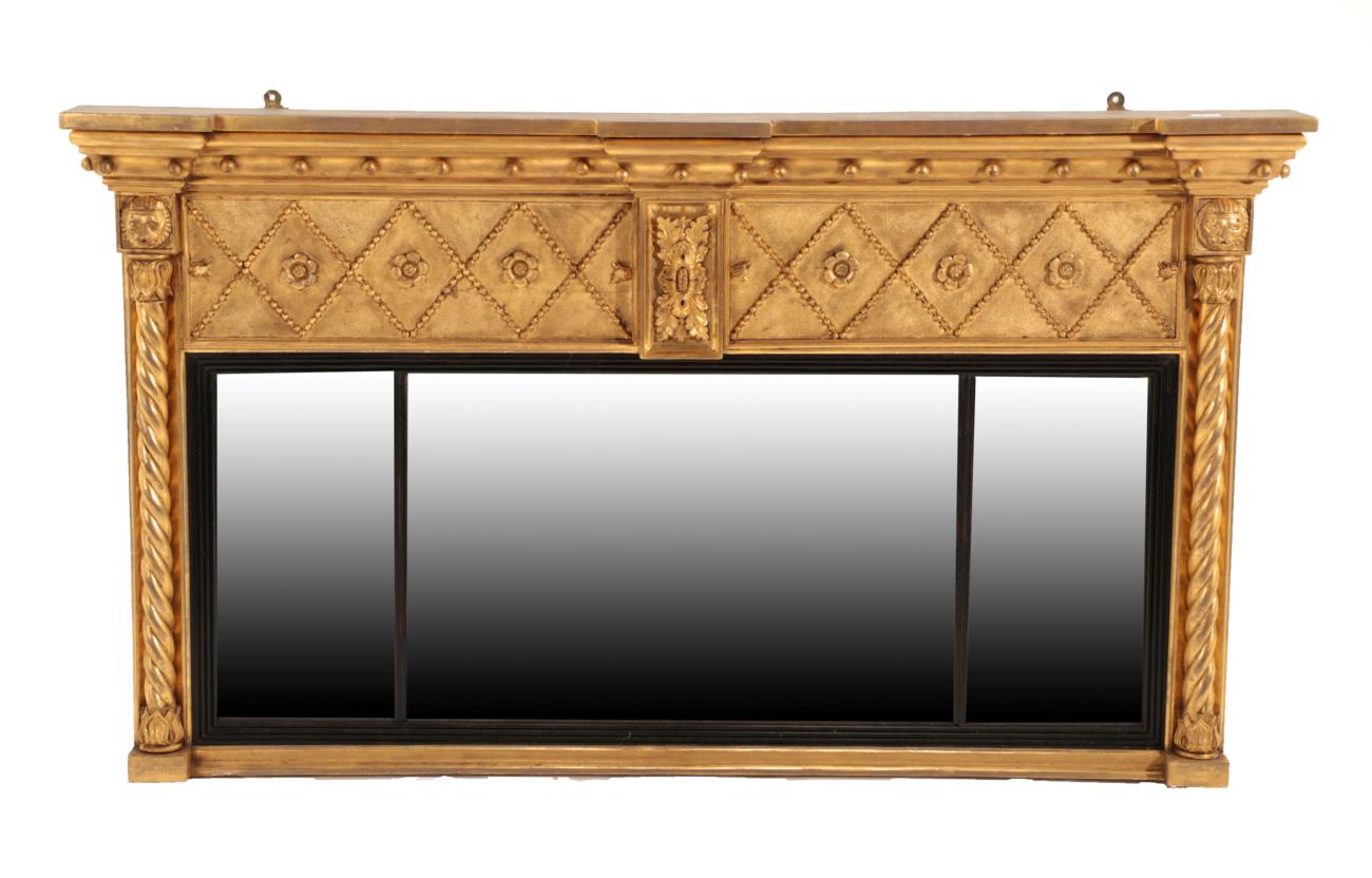 Lot 736 - A Regency Gilt and Gesso Overmantel Mirror, early 19th century, of breakfront form with ball...