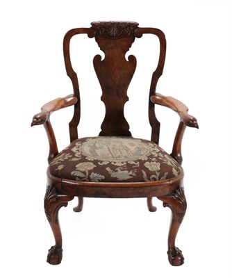 Lot 747 - A Carved Walnut Armchair, possibly by Gillows, 19th century, the vasiform solid splat above...