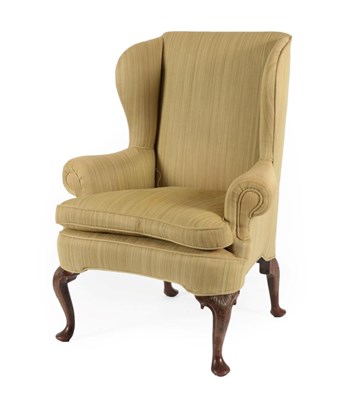 Lot 748 - A George III Mahogany Framed Wing-Back Armchair, late 18th century, recovered in green fabric, with