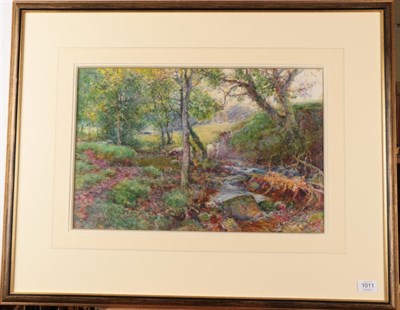 Lot 1011 - Samuel John Lamorna Birch, RA, RWS (1869-1955) Cattle in a woodland, signed, watercolour, 35cm...