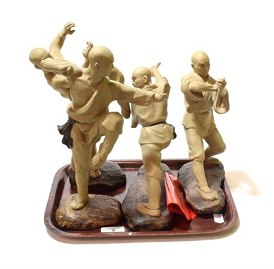 Lot 9 - A set of four Chinese fighting figures stamped and labelled Shiwan