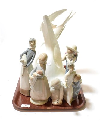 Lot 19 - Four Lladro figures, one Nao figure, and a Royal Doulton Images model titled 'Courtship' HN3525 (6)