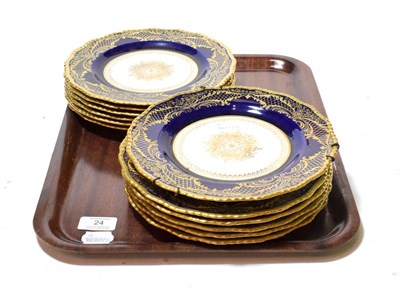 Lot 24 - A set of twelve Royal Doulton Higgins & Setter dessert plates, decorated with gilt borders on a...