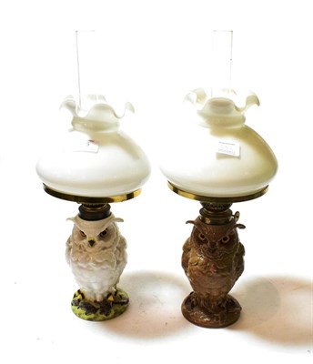 Lot 25 - A matched pair of ceramic owl form oil lamps, one brown gloss the other white, both with glass eyes