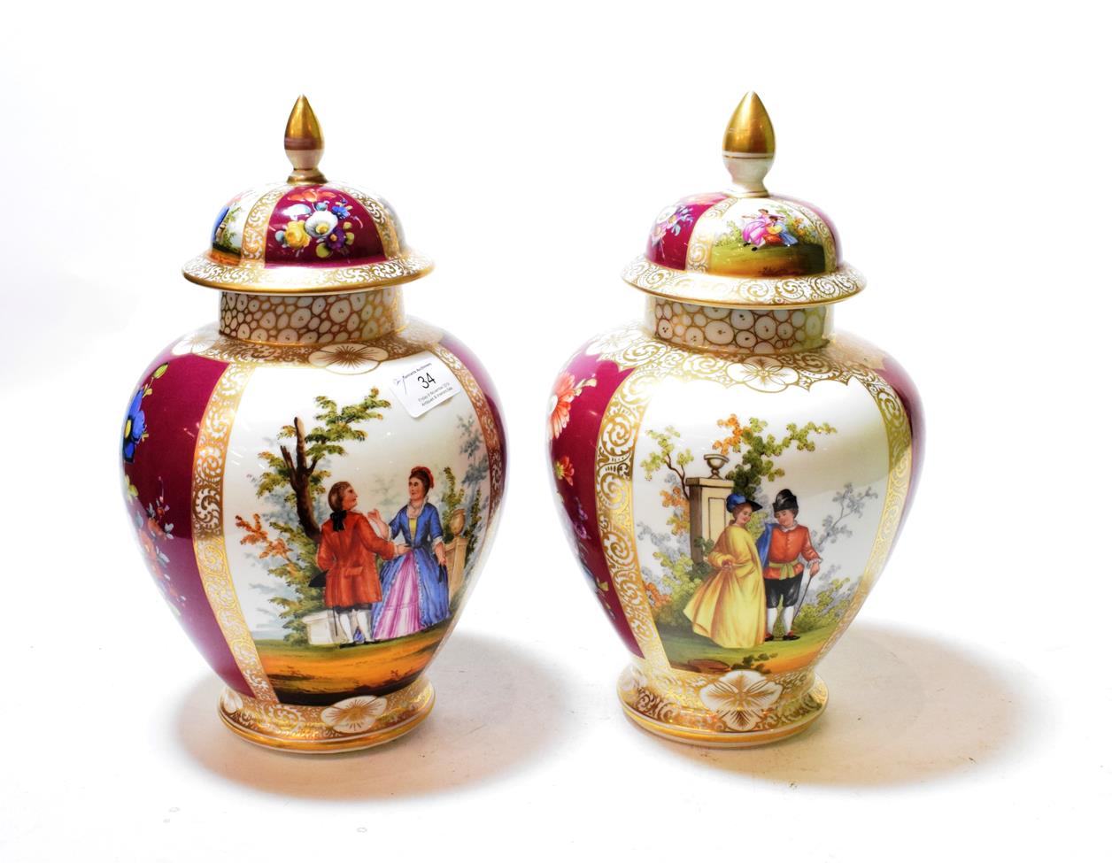 Lot 34 - A pair of Dresden ovoid vases and covers