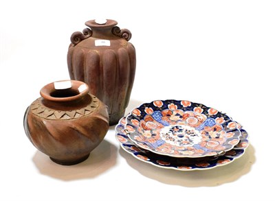Lot 48 - Two early 20th century Japanese Imari chargers, together with two terracotta vases (4)