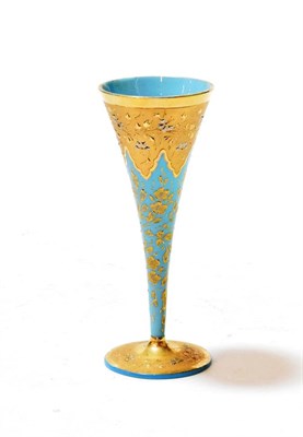 Lot 111 - A blue glass goblet, late 19th century, of conical form with gilt decoration, 19cm high