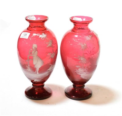 Lot 129 - A pair of Victorian Mary Gregory style cranberry glass vases