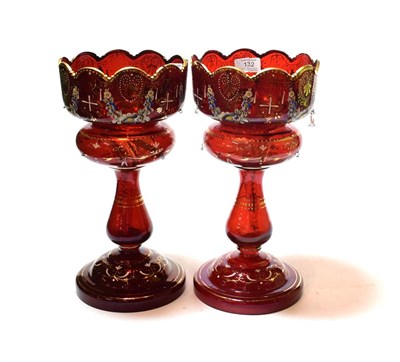 Lot 132 - A pair of Victorian gilt highlighted ruby glass table lustres