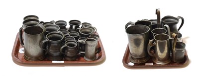 Lot 133 - Two trays of 18th, 19th and 20th century pewter measures and tankards