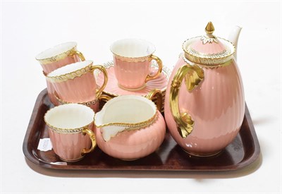 Lot 139 - A Royal Crown Derby coffee set, pink ground, gilt embellished, six settings, damage to spout (15)