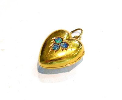 Lot 215 - A 15 carat gold opal set heart locket, length 2.7cm