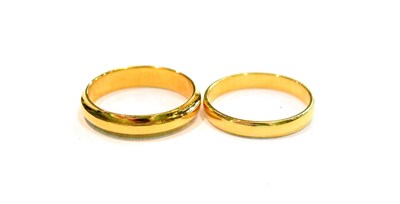 Lot 268 - Two 18 carat gold band rings, finger sizes N and O (2)