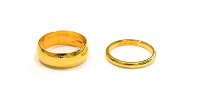 Lot 273 - Two 18 carat gold band rings, finger sizes I and K1/2