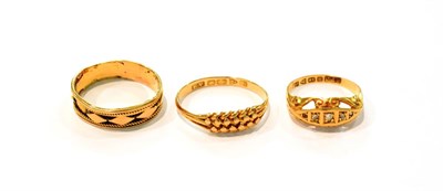 Lot 298 - An 18 carat gold fancy band ring and another 18 carat gold ring, both out of shape; together...