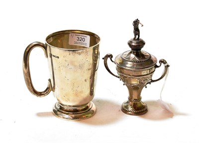 Lot 320 - A George V silver golf trophy and a George V silver mug, the first by Joseph Rogers and Sons,...