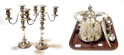 Lot 337 - A mixed lot of silver-plate, including: a pair of three-light candelabra; a condiment set with...