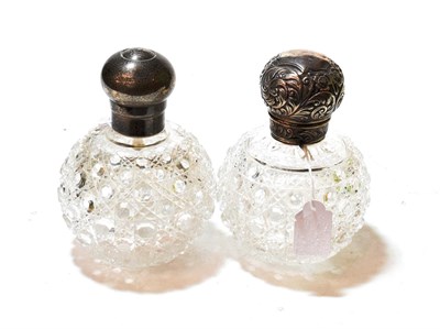 Lot 343 - Two Victorian silver-mounted cut-glass scent bottles, one maker's mark rubbed, London, 1900,...