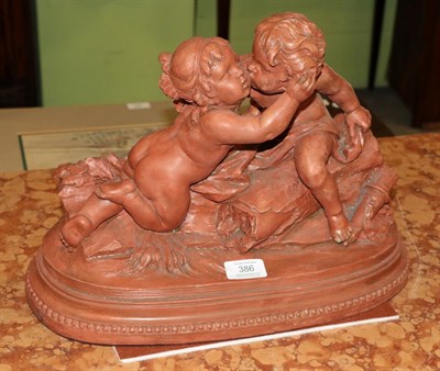 Lot 386 - A 19th century terracotta figure group of putti, signed CHOLIN