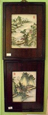 Lot 396 - A decorative pair of Chinese porcelain panels painted with figures, buildings, a fisherman and...