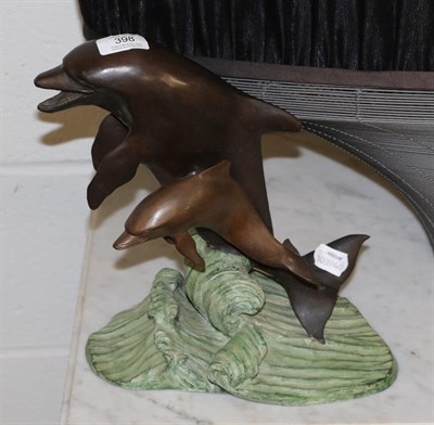 Lot 398 - A bronze model of leaping dolphins