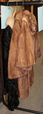 Lot 404 - Walsh Sheffield cropped light brown mink jacket; a black astracan coat with mink collar; and a...