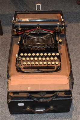 Lot 1123 - Three boxed typewriters by Corona and Royal