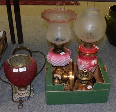 Lot 1126 - Two Victorian oil lamps; a Victorian ruby glass oil lamp base; a Linthorpe pottery oil lamp...