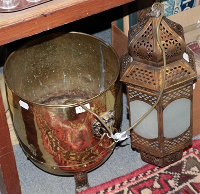 Lot 1147 - A brass coal bin with lion mask handles, an Indian lamp and a reproduction tapestry