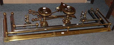 Lot 1165 - Two brass trivets; a fender; andirons; a curb; and tools