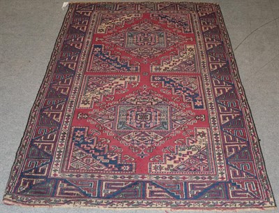 Lot 1201 - Anatolia rug, the raspberry field with two panels containing diamond medallions, enclosed by...