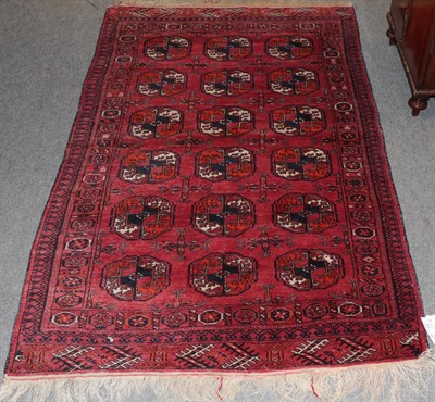 Lot 1203 - Tekke rug, the crimson field with three rows of guls enclosed by octagon borders, 165cm by 100cm