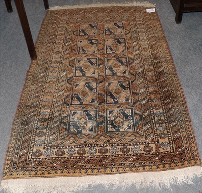 Lot 1209 - Afghan 'Gold' rug, the compartmentalised field of guls enclosed by multiple borders, 187cm by 111cm