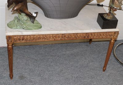 Lot 1219 - A gilt rectangular coffee table with marble top