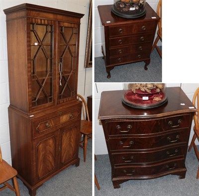 Lot 1224 - A reproduction mahogany secretaire bookcase; a reproduction mahogany four-drawer chest; and a small