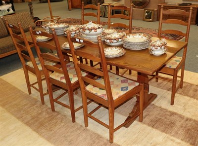 Lot 1229 - An Ercol pine refectory table and six ladder back chairs (7)