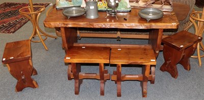 Lot 1231 - A yew wood dining table and four yew wood rectangular stools (5)