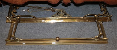 Lot 1248 - A late 19th century brass fire curb, 154cm wide; a smaller early 20th century brass fire curb,...
