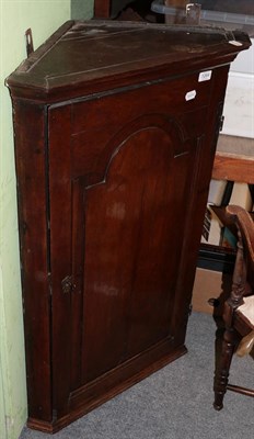 Lot 1264 - An 18th century oak hanging corner cupboard, 99cm high