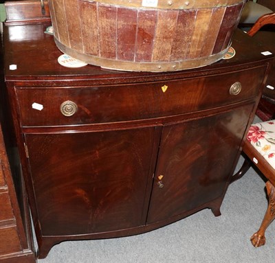 Lot 1268 - A George II style mahogany bow fronted cabinet, with single drawer above two cupboard doors