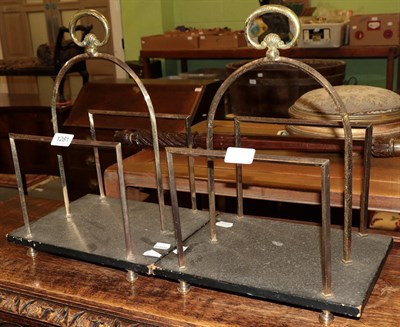 Lot 1281 - A pair of reproduction brass two division magazine racks with loop handles