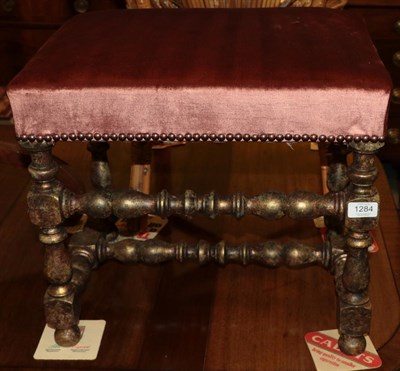 Lot 1284 - A gilded dressing stool with turned stretchers and a silk overstuffed seat, 47cm wide