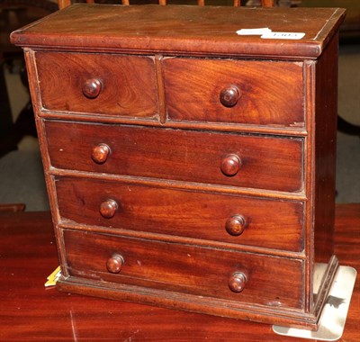 Lot 1303 - A 19th century mahogany miniature four-height chest of drawers