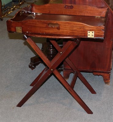 Lot 1304 - A mahogany and brass bound butlers tray with associated stand