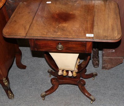 Lot 1306 - A small Regency work table with sliding box