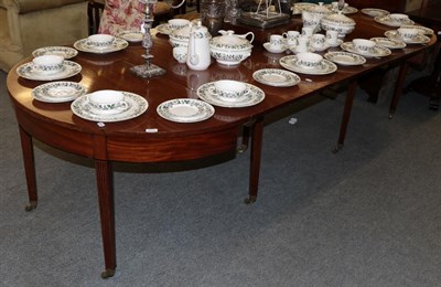 Lot 1310 - A George III mahogany D end extending dining table with three additional leaves, on square tapering