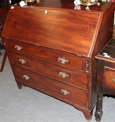 Lot 1313 - A George III mahogany bureau, the interior with eight pigeon holes and small drawers, the base with