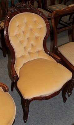 Lot 1322 - A Victorian carved whatnot chair, upholstered to match previous lot