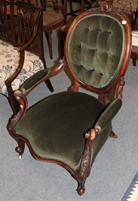 Lot 1330 - A Victorian walnut framed open armchair upholstered in green velvet, 64cm wide