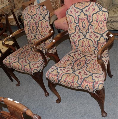 Lot 1333 - A pair of 1920s walnut framed armchairs, on shell carved cabriole forelegs, 63cm wide